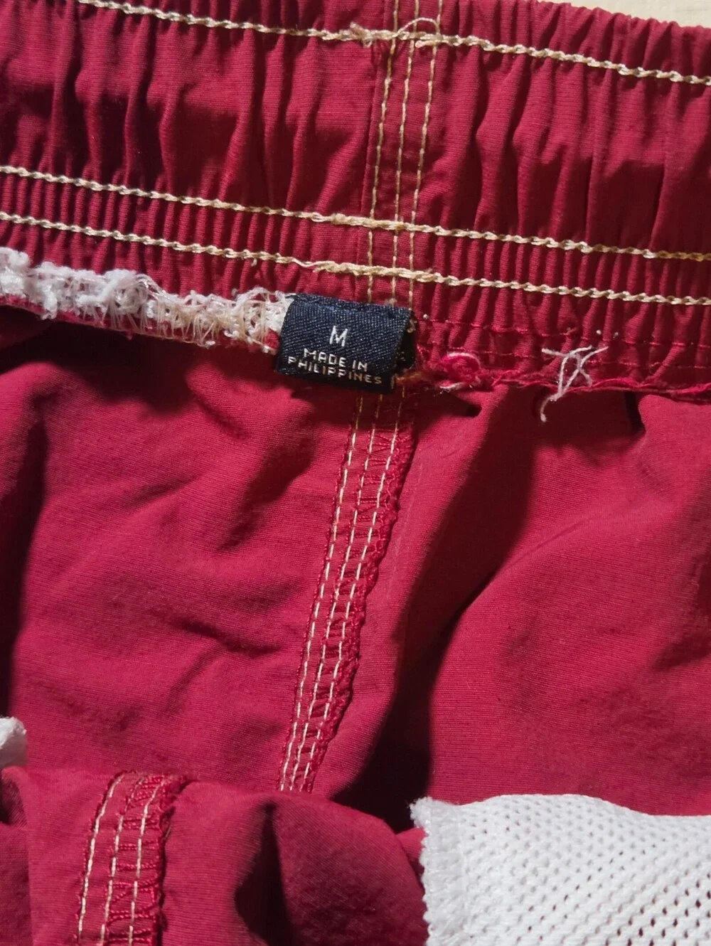 Tommy Hilfiger burgundy swim trunks with side stripe